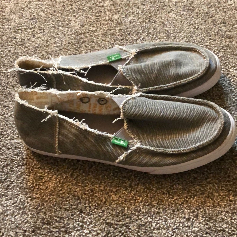 Sanuk slip on shoes.